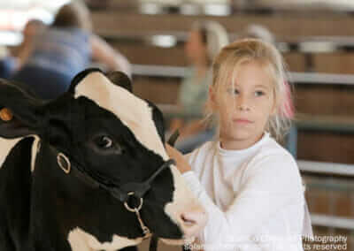 Girl Showing Cow