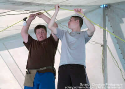 Boys Installing Tent Wiring