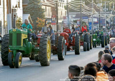 Long Line of Tractors in Parade
